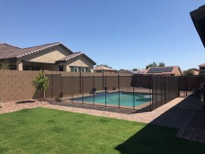 Building a fence around your pool is one of many childproofing tips for homes with this feature.